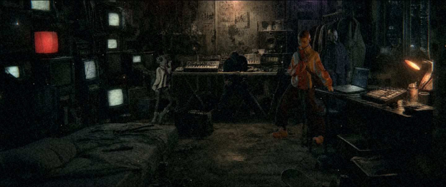 The SUPERDARK room at night: a wall of televisions, a synth table under a bare bulb, a desk under a window. Four artists stand in it.